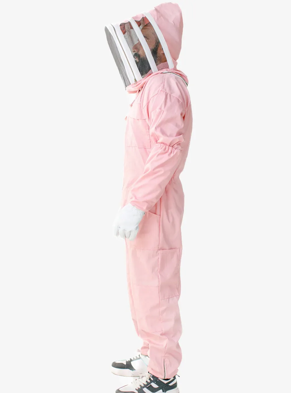 Side profile of a beekeeper in a pink cotton bee suit with the fencing veil up, showing room at the back and seat