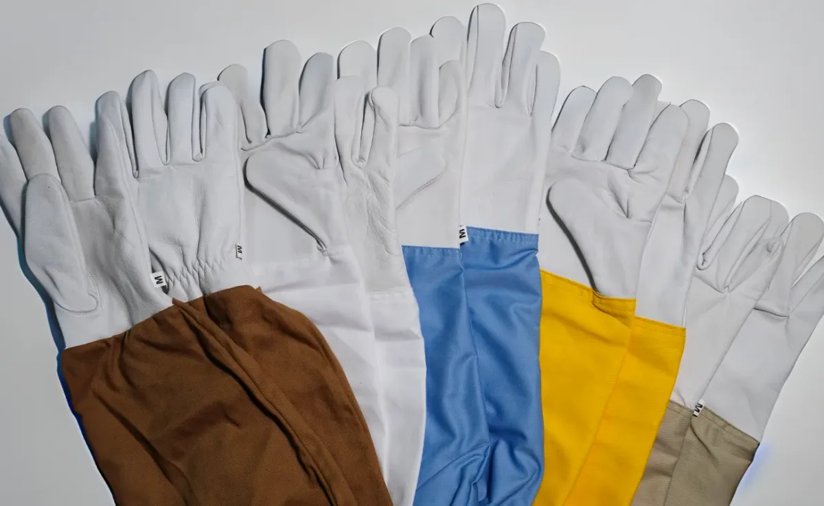 Five pairs of goatskin beekeeping gloves with brown, white, blue, yellow and beige cotton gauntlets