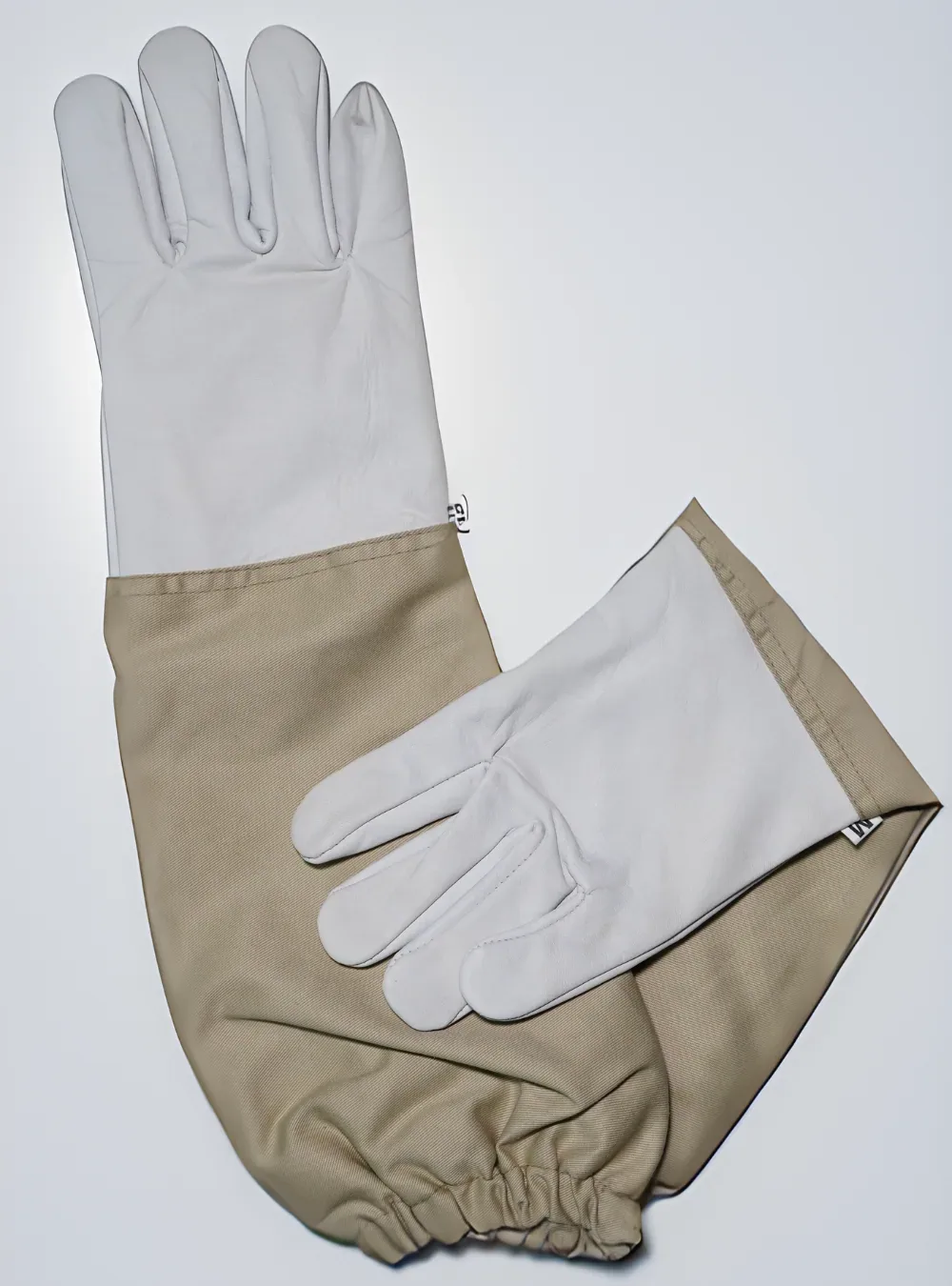 White goatskin beekeeping gloves with a long beige cotton gauntlet