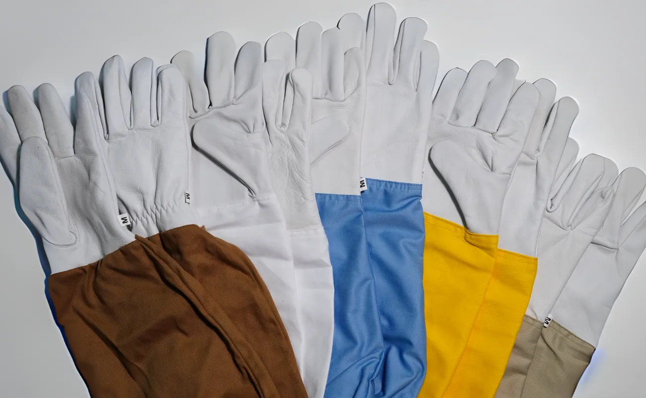 Cotton and goatskin beekeeping gloves in five colours, laid flat